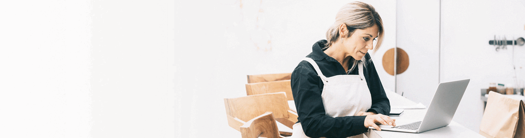 Small business owner researching investment property loan options online in South Australia.