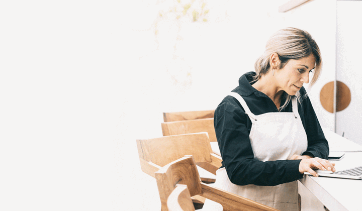 Small business owner researching investment property loan options online in South Australia.