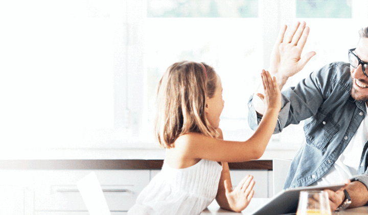 Father and daughter celebrating at home after securing a variable home loan in South Australia.